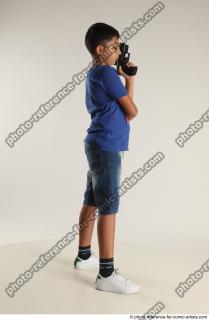 TIMBO STANDING POSE WITH GUN